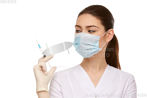 Image of woman doctor with syringe isolated on white