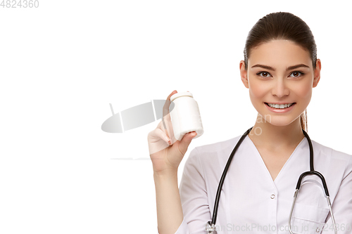 Image of woman doctor with pills isolated on white