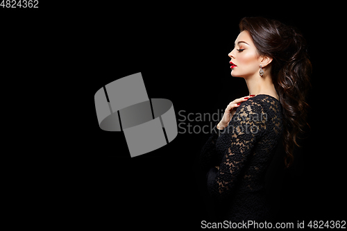 Image of beautiful young woman with red lips on black