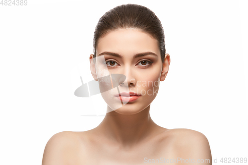 Image of girl applying powder on face isolated on white