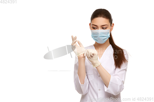 Image of woman doctor in rubber gloves isolated on white