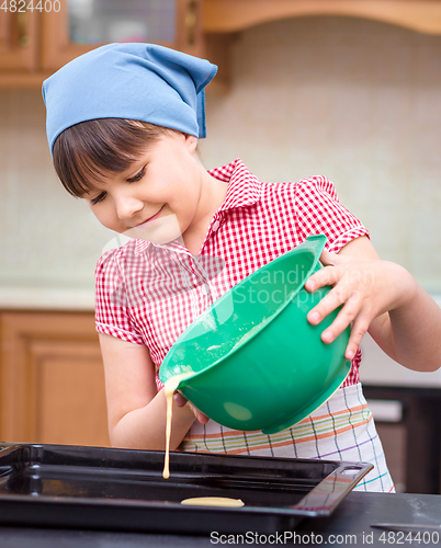 Image of Girl is cooking in kitchen