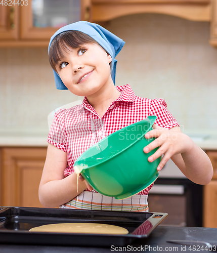 Image of Girl is cooking in kitchen