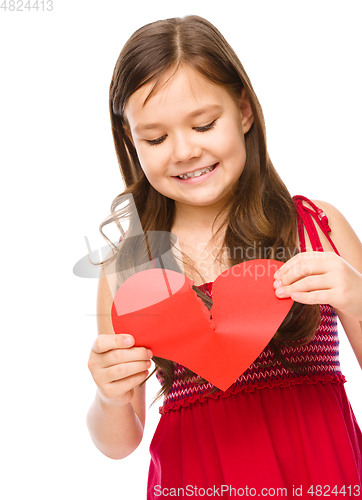 Image of Portrait of a happy little girl in red