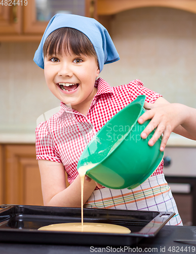 Image of Girl is cooking in kitchen