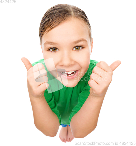 Image of Little girl is showing thumb up gesture