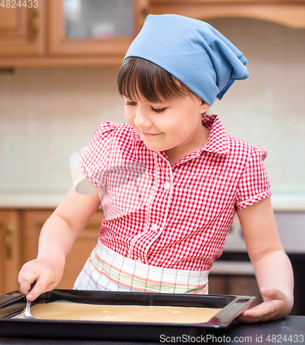 Image of Girl is cooking in kitchen