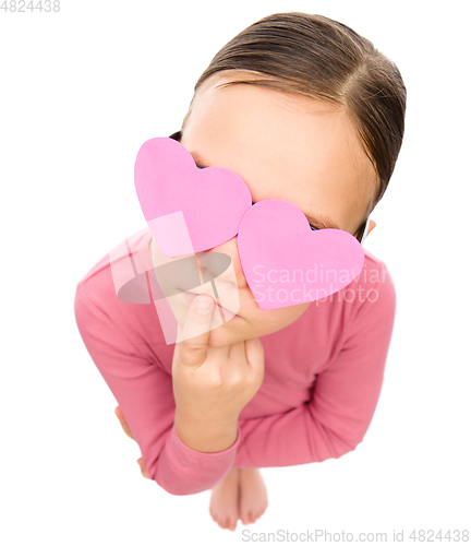 Image of Little girl with hearts over her eyes