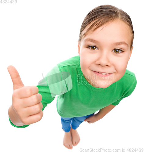 Image of Little girl is showing thumb up gesture