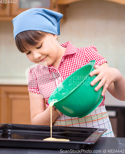 Image of Girl is cooking in kitchen