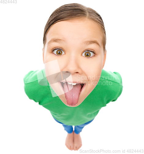 Image of Funny little girl sticking her tongue out