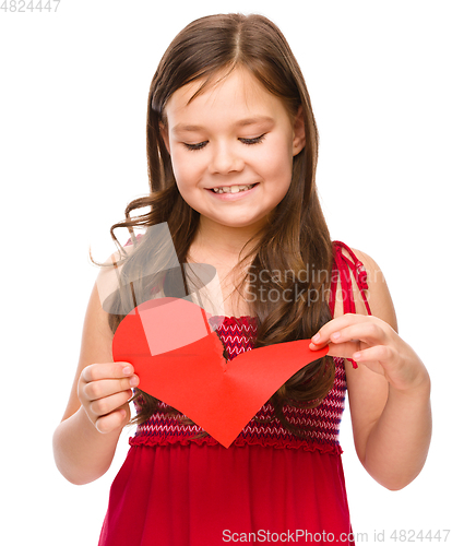 Image of Portrait of a happy little girl in red