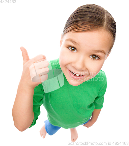 Image of Little girl is showing thumb up gesture