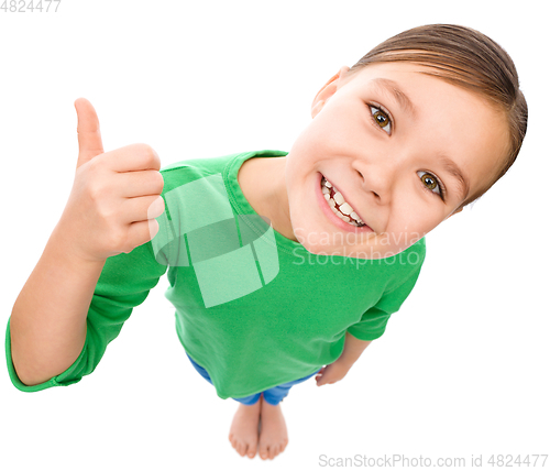 Image of Little girl is showing thumb up gesture