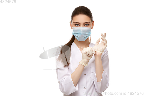 Image of woman doctor in rubber gloves isolated on white