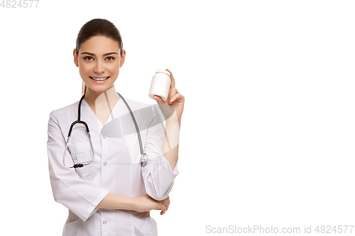 Image of woman doctor with pills isolated on white