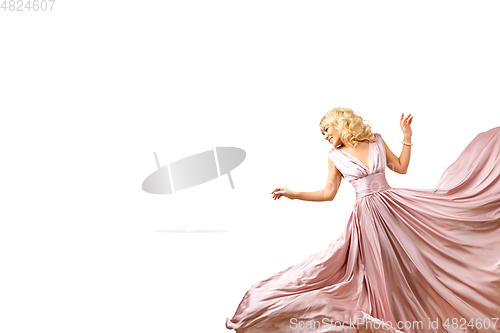 Image of girl in flying pink dress isolated on white