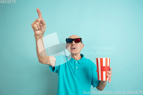 Image of Caucasian senior man\'s portrait isolated on blue studio background