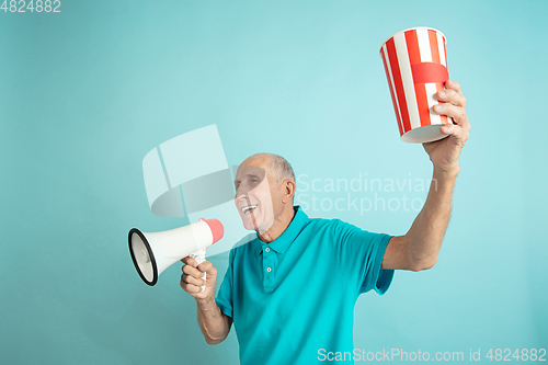 Image of Caucasian senior man\'s portrait isolated on blue studio background