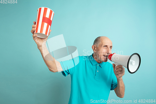 Image of Caucasian senior man\'s portrait isolated on blue studio background