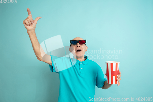 Image of Caucasian senior man\'s portrait isolated on blue studio background