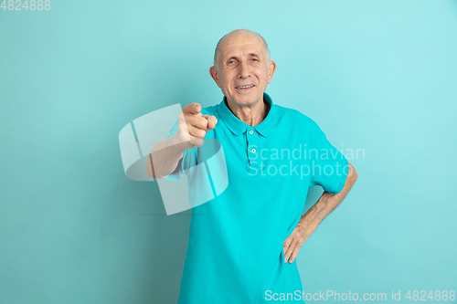 Image of Caucasian senior man\'s portrait isolated on blue studio background