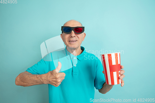 Image of Caucasian senior man\'s portrait isolated on blue studio background