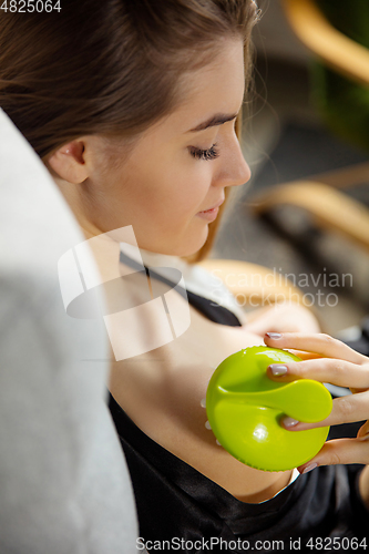 Image of Beauty Day. Woman doing her daily skincare routine at home