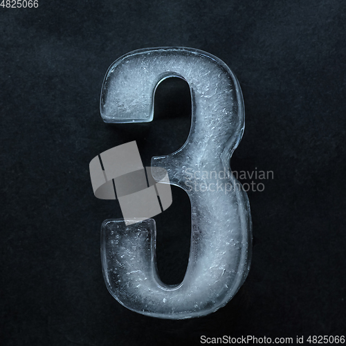 Image of Numeric value, numbers made out of ice isolated on dark studio background