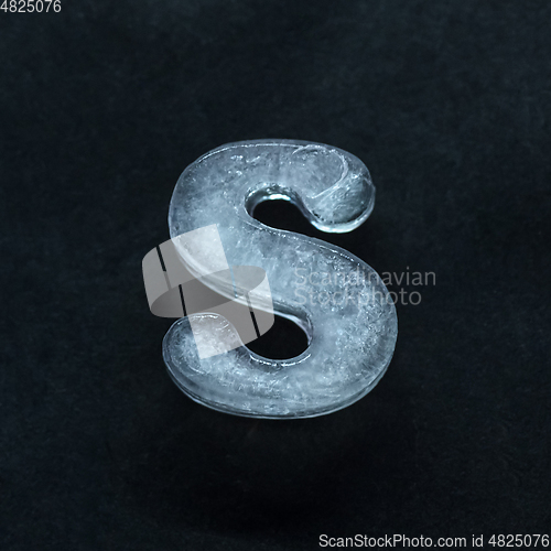 Image of Alphabet\'s letters made out of ice isolated on dark studio background