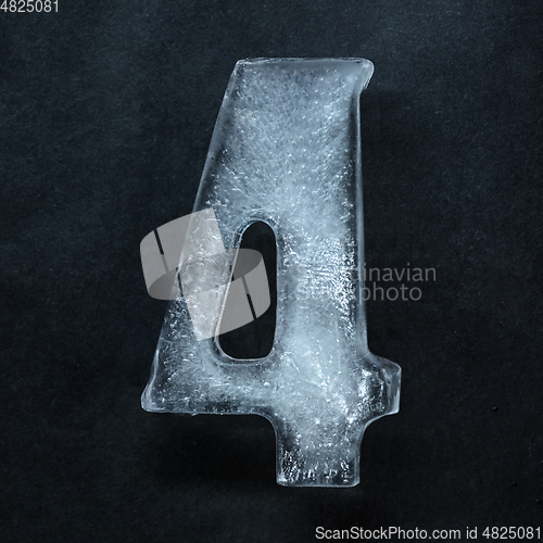 Image of Numeric value, numbers made out of ice isolated on dark studio background