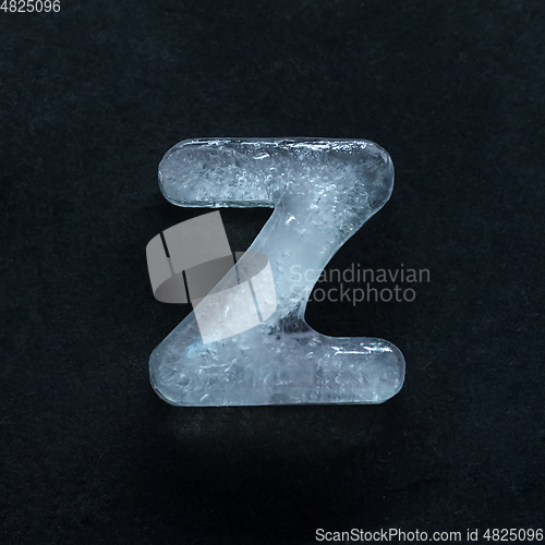 Image of Alphabet\'s letters made out of ice isolated on dark studio background