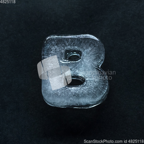 Image of Alphabet\'s letters made out of ice isolated on dark studio background