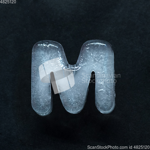 Image of Alphabet\'s letters made out of ice isolated on dark studio background