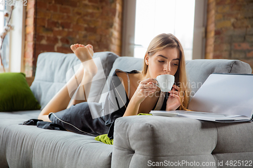 Image of Beauty Day. Woman doing her daily skincare routine at home