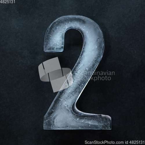 Image of Numeric value, numbers made out of ice isolated on dark studio background