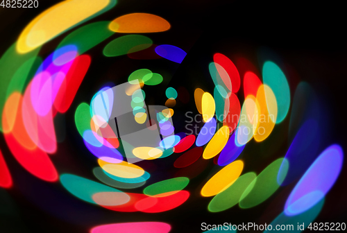 Image of Bright unfocused colorful lights in night