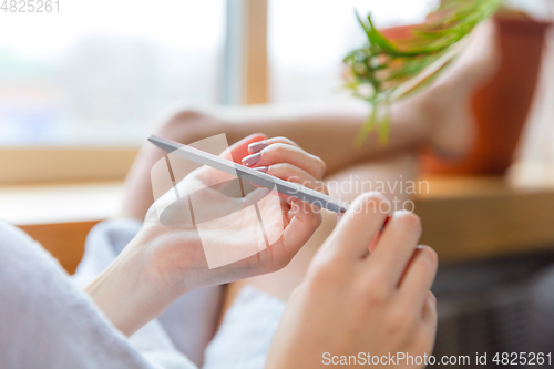 Image of Beauty Day. Woman doing her daily skincare routine at home