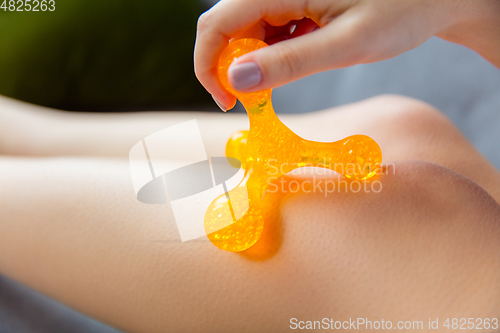 Image of Beauty Day. Woman doing her daily skincare routine at home