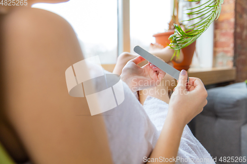 Image of Beauty Day. Woman doing her daily skincare routine at home