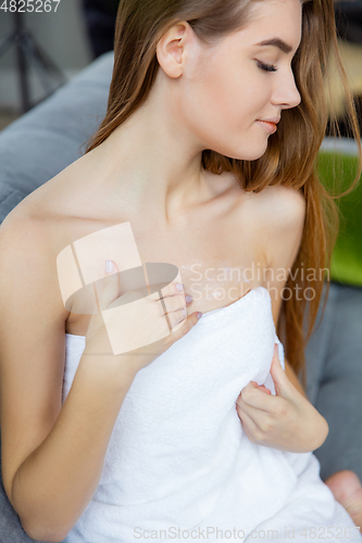 Image of Beauty Day. Woman doing her daily skincare routine at home