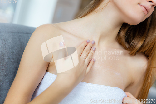 Image of Beauty Day. Woman doing her daily skincare routine at home