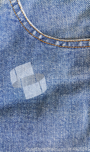 Image of Fragment of classic blue fashioned jeans