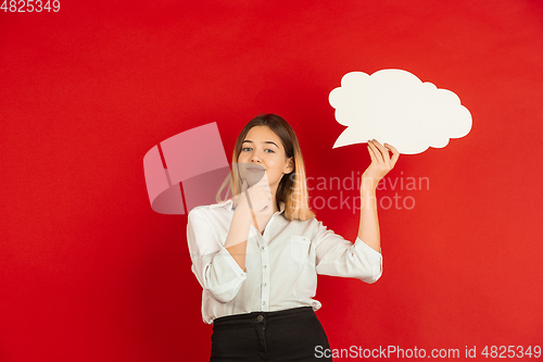 Image of Valentine\'s day celebration, happy caucasian girl isolated on red background