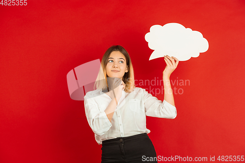 Image of Valentine\'s day celebration, happy caucasian girl isolated on red background