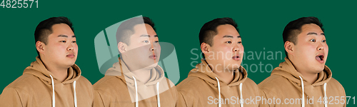 Image of Evolution of emotions. Asian man\'s portrait isolated over green studio background with copyspace