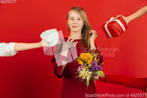 Image of Valentine\'s day celebration, happy caucasian girl isolated on red background