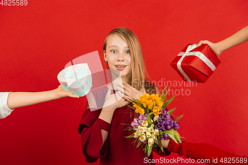 Image of Valentine\'s day celebration, happy caucasian girl isolated on red background