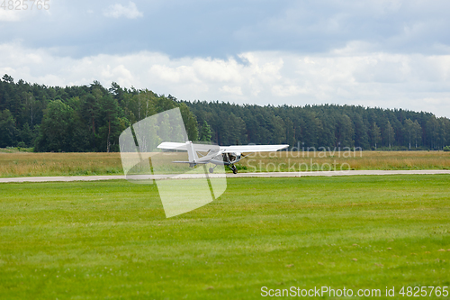 Image of outdoor shot of small plane taking off