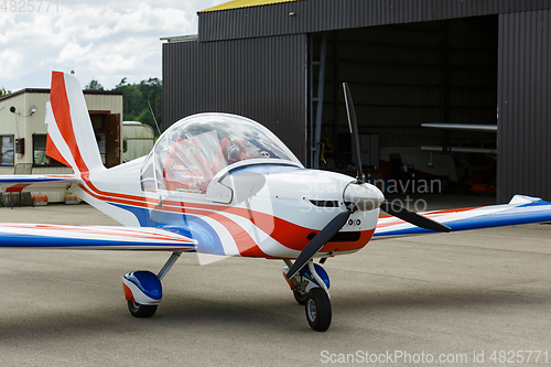 Image of outdoor shot of small plane standing in shed